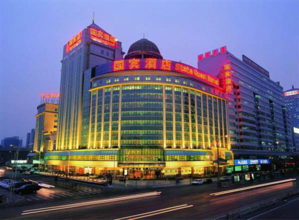 a large building with red lights on top of it at The Presidential Beijing in Beijing