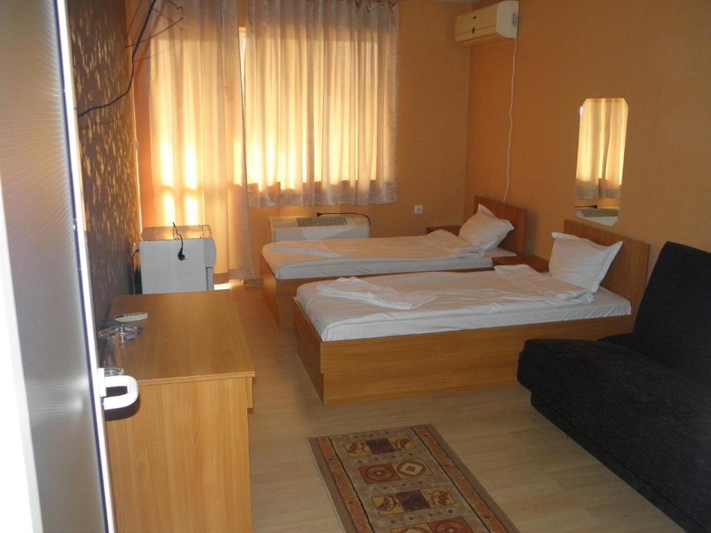 Postel nebo postele na pokoji v ubytování Hotel Pilevski