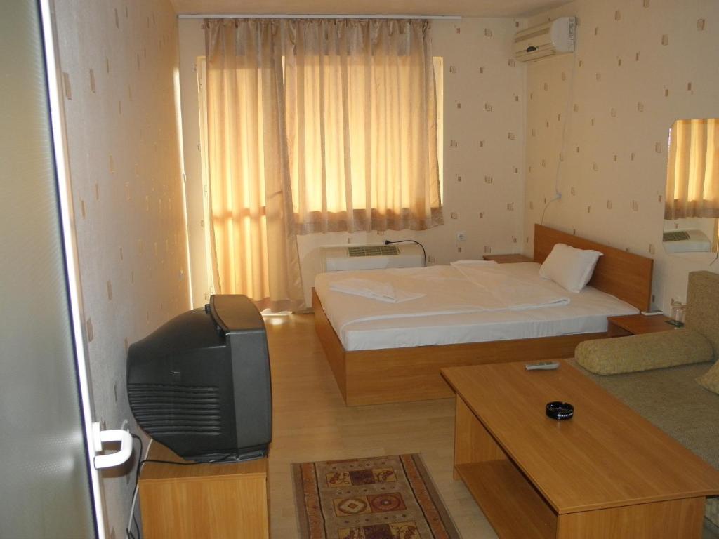 Postel nebo postele na pokoji v ubytování Hotel Pilevski