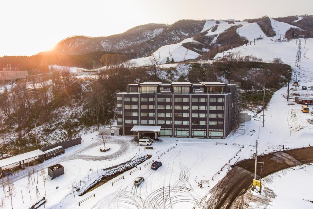 a large building with a ski lift on top of it at Ki Niseko in Niseko