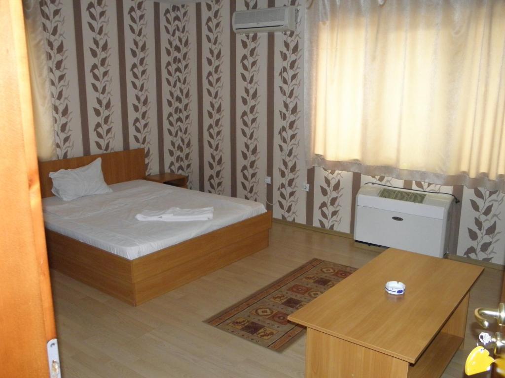 Postel nebo postele na pokoji v ubytování Hotel Pilevski