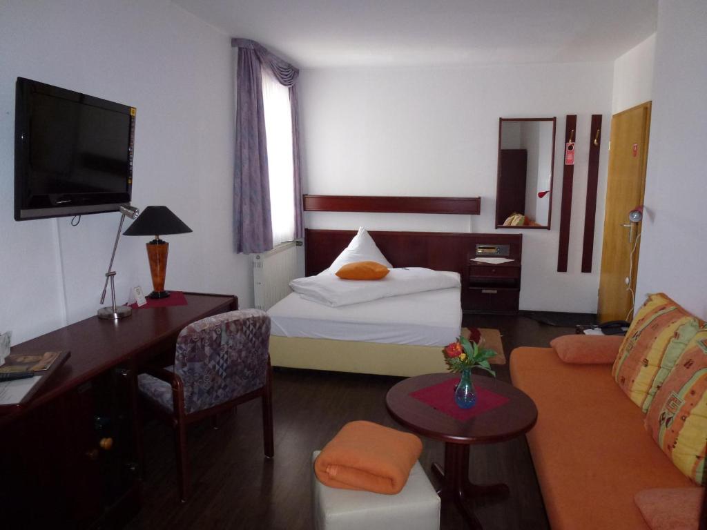 Postel nebo postele na pokoji v ubytování Hotel Wildunger Hof mit Gemeinschaftsküche