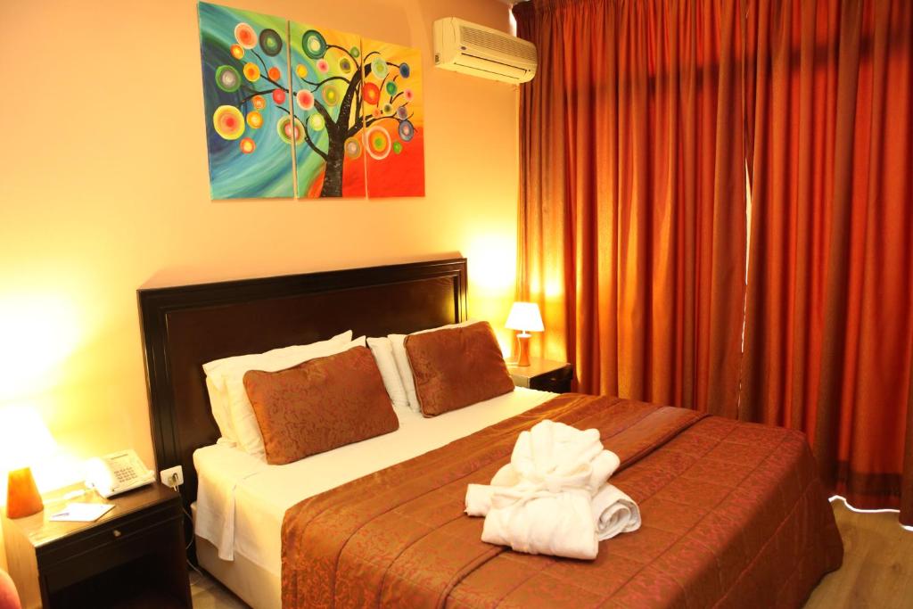 Postel nebo postele na pokoji v ubytování Mozart Hotel