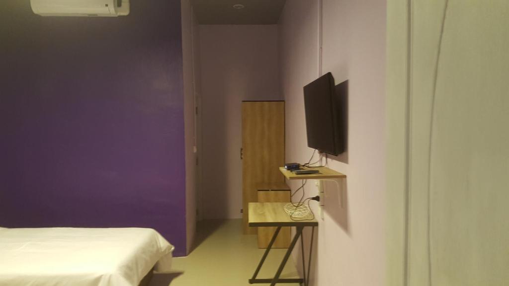 Postel nebo postele na pokoji v ubytování Baan Sang Chan 3