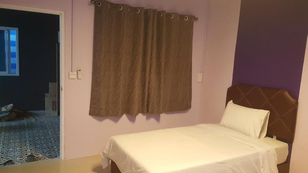 Postel nebo postele na pokoji v ubytování Baan Sang Chan 3