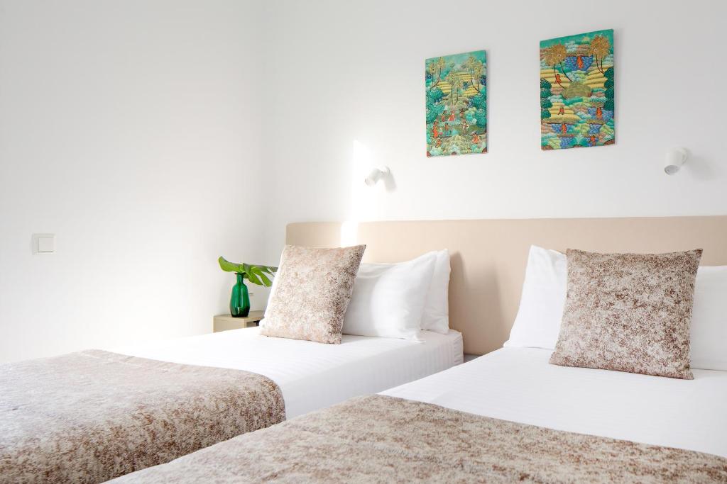 Postel nebo postele na pokoji v ubytování Apartamentos El Guarapo
