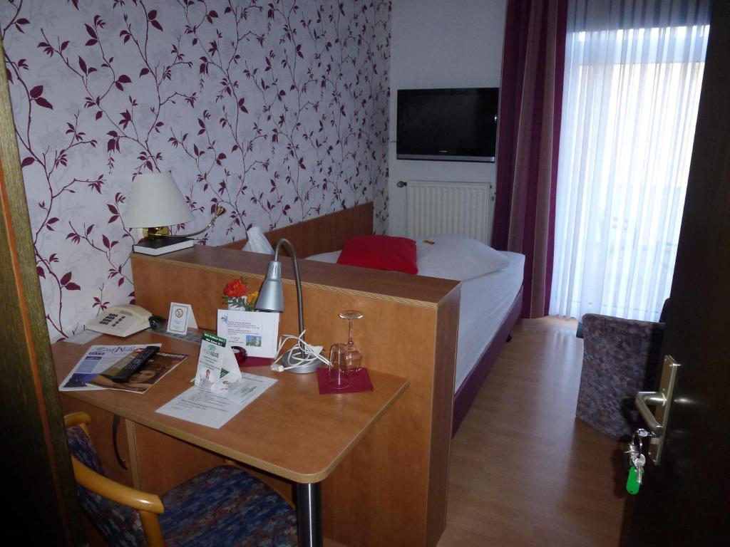 Postel nebo postele na pokoji v ubytování Hotel Wildunger Hof mit Gemeinschaftsküche