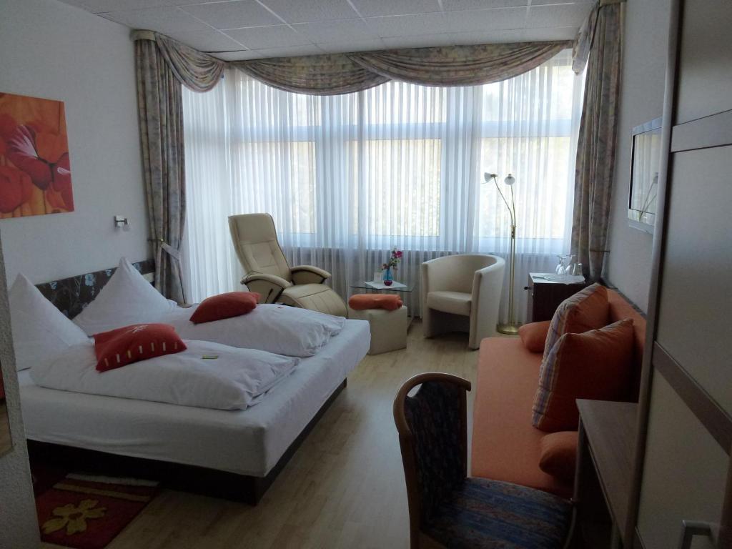 Postel nebo postele na pokoji v ubytování Hotel Wildunger Hof mit Gemeinschaftsküche