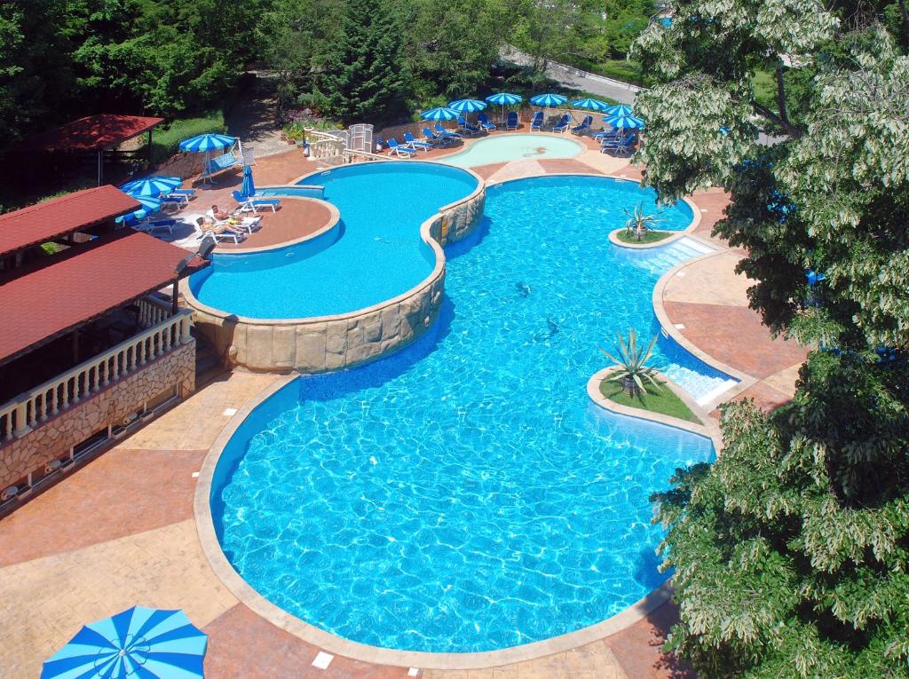 an overhead view of a swimming pool at a resort at Havana Hotel - All Inclusive in Golden Sands