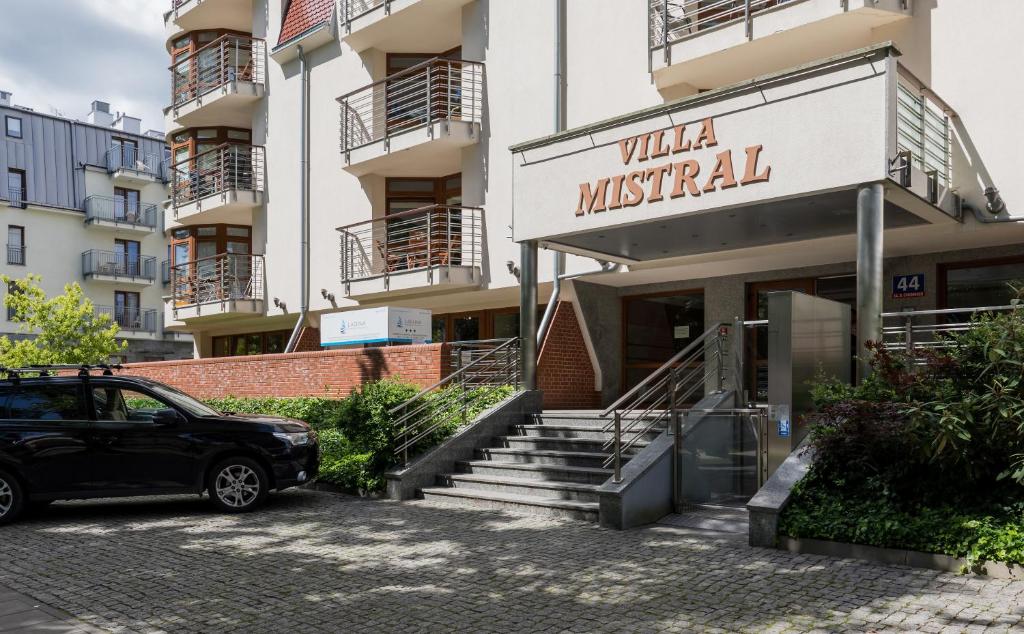 a car parked in front of a building at Apartament Villa Mistral by Renters in Świnoujście