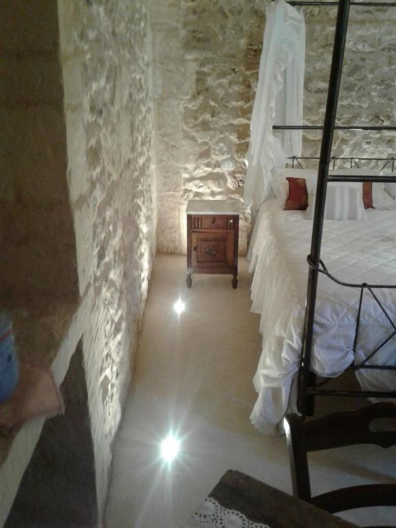 Łóżko lub łóżka w pokoju w obiekcie Borgo in corte