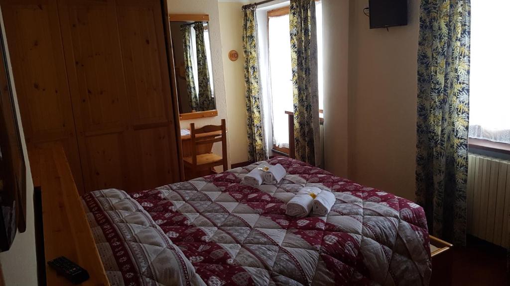 Кровать или кровати в номере Hotel Martin