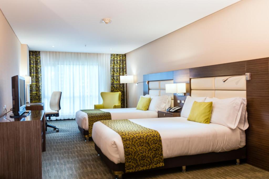 Postel nebo postele na pokoji v ubytování Casa Dann Carlton Hotel & SPA