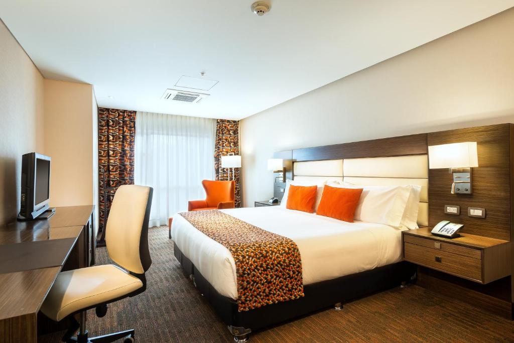 Postel nebo postele na pokoji v ubytování Casa Dann Carlton Hotel & SPA