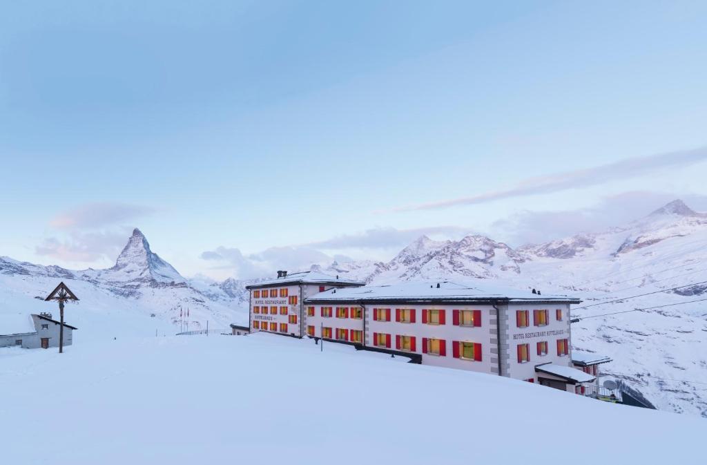 a building on top of a snow covered mountain at Riffelhaus 1853 in Zermatt