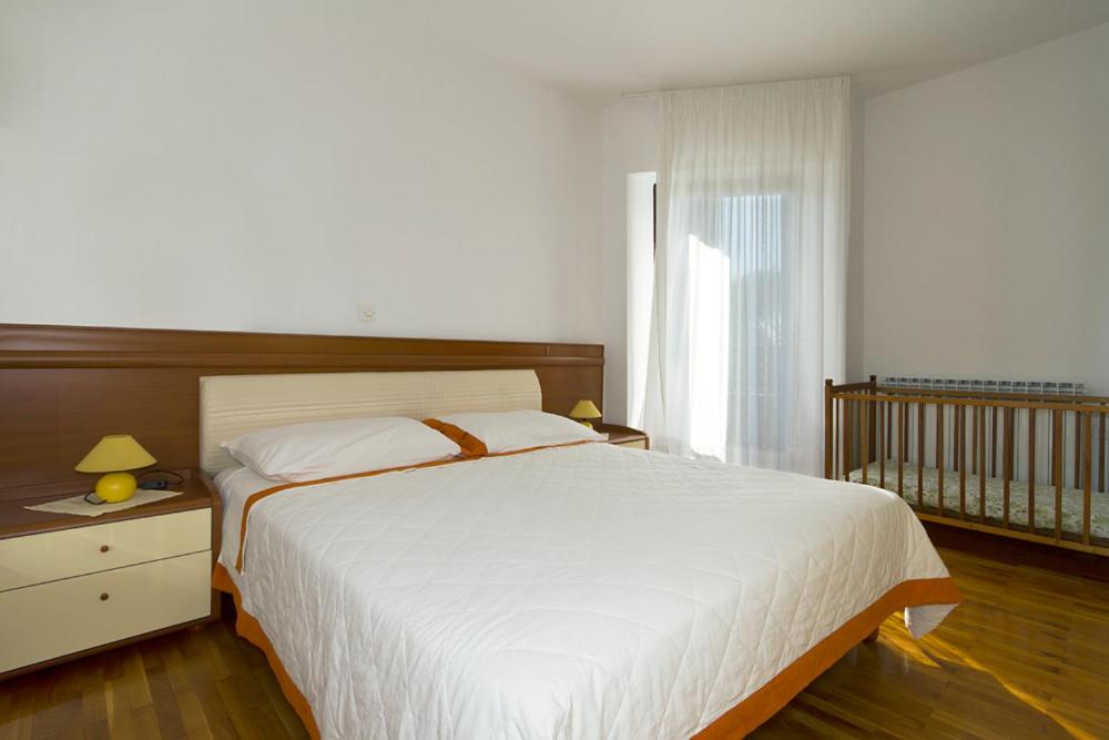 Postel nebo postele na pokoji v ubytování Apartment Villa Gasparini