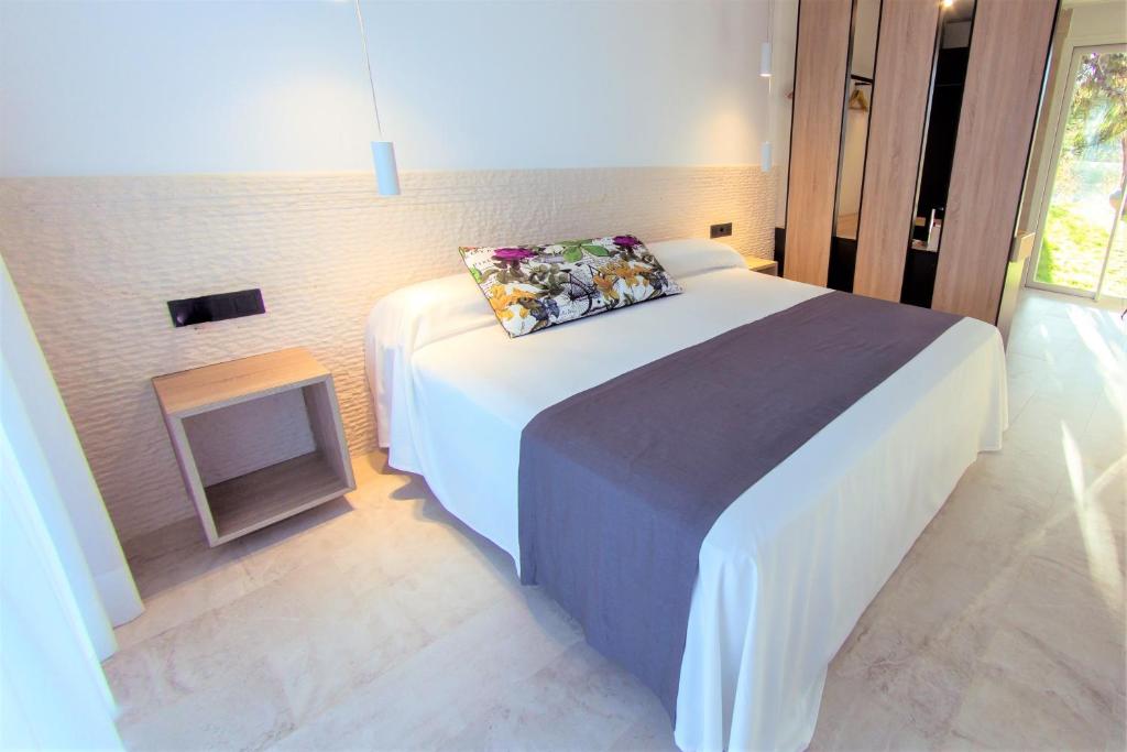 Postel nebo postele na pokoji v ubytování Botaniq Hotel Boutique