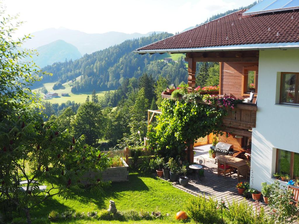 a house with a view of the mountains at Ferienwohnung Hübner in Brandenberg