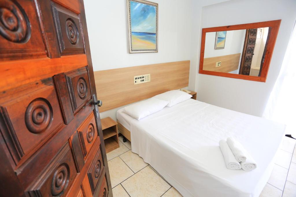 Postel nebo postele na pokoji v ubytování Lumar Hotel