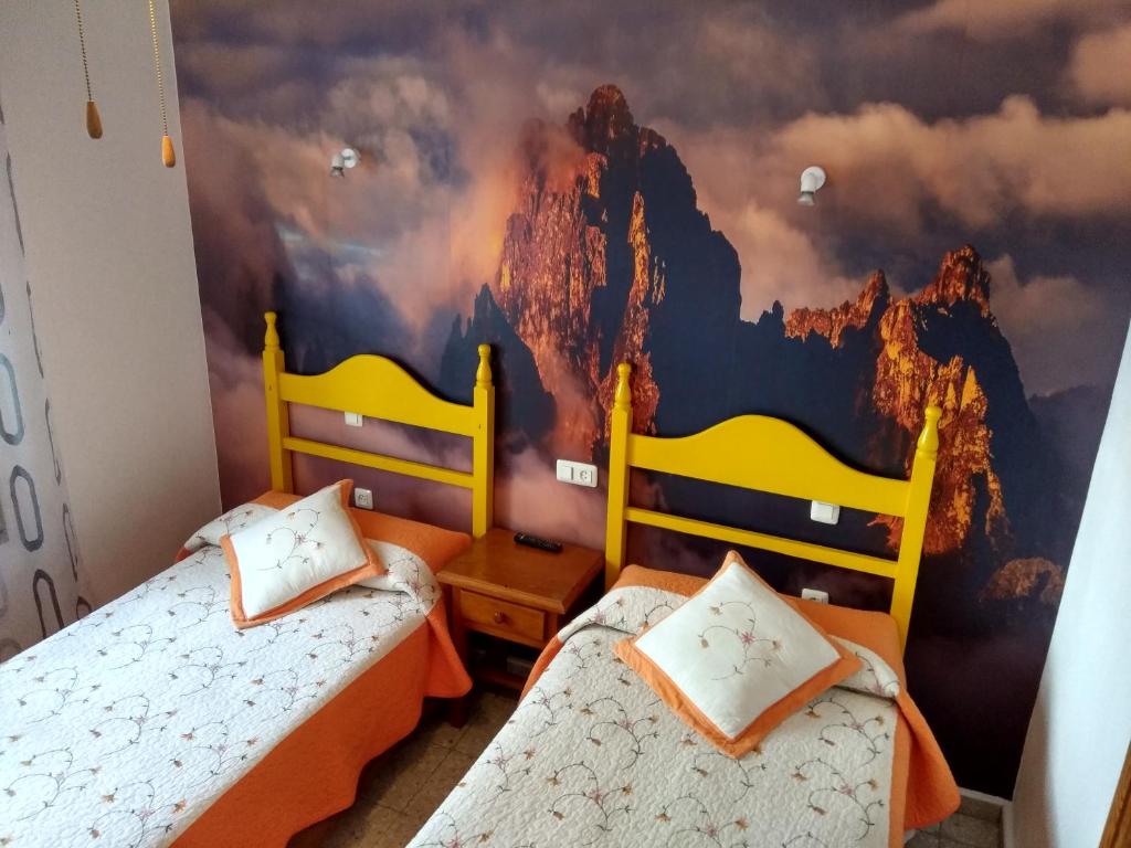 Postel nebo postele na pokoji v ubytování Hostal Avenida