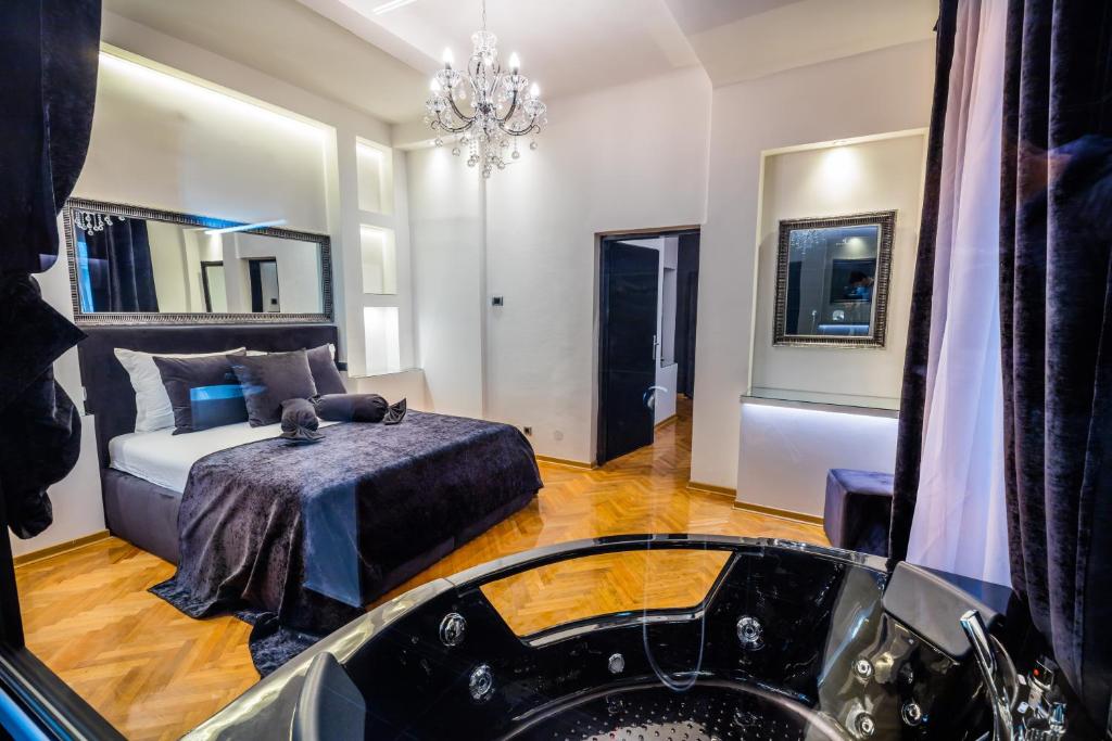 Postel nebo postele na pokoji v ubytování Ben Akiba Luxury Suites