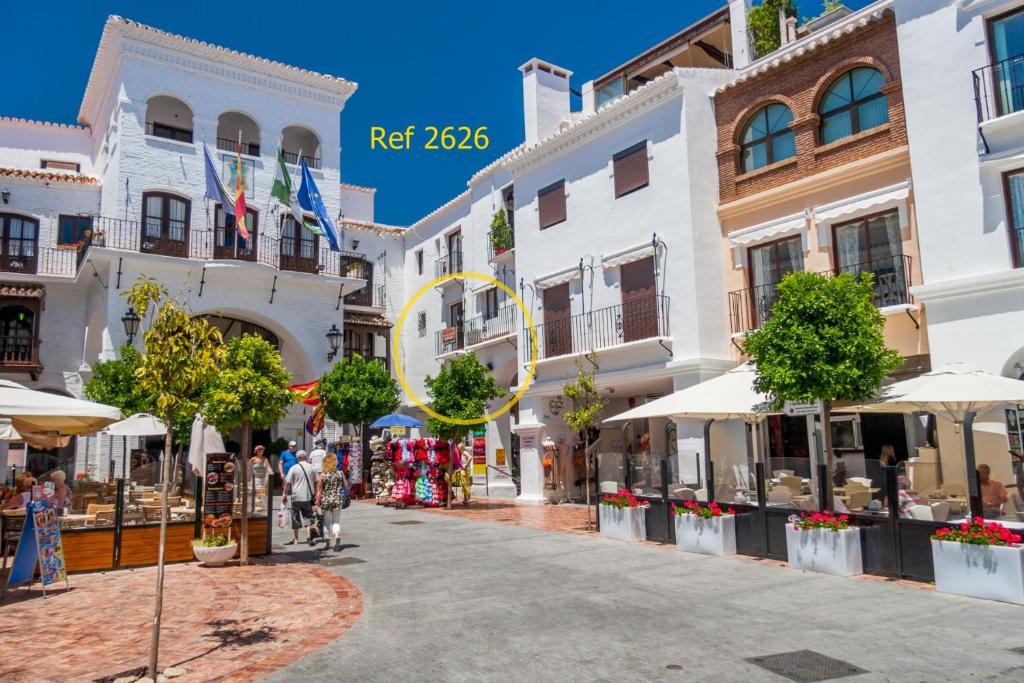 a street in a town with white buildings at Canovas Nerja - Balcón de Europa in Nerja