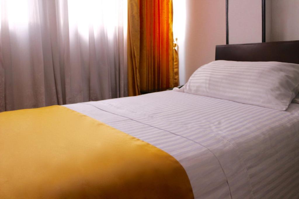 Postel nebo postele na pokoji v ubytování Hotel Ferrovial Corferias