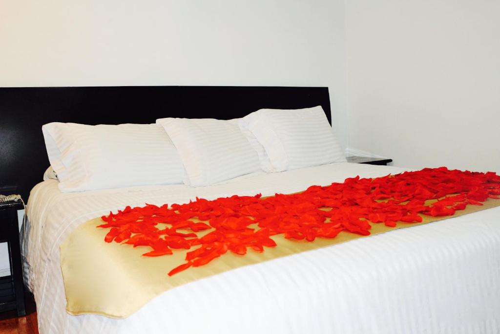 Postel nebo postele na pokoji v ubytování Hotel Ferrovial Corferias