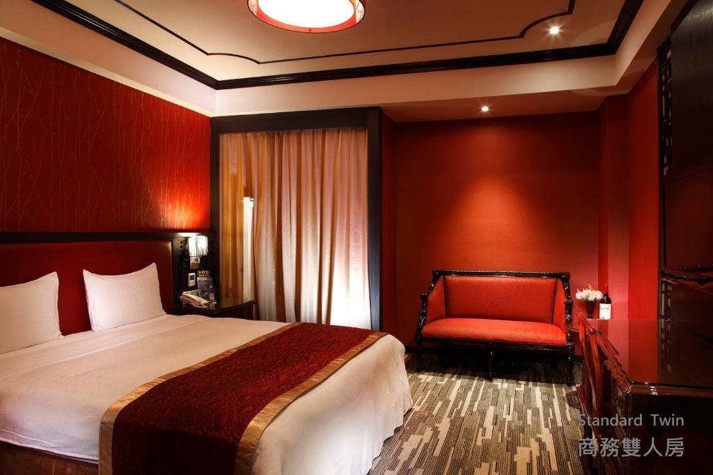 Postel nebo postele na pokoji v ubytování Grace Hotel