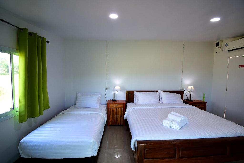 Postel nebo postele na pokoji v ubytování Anissa Resort Koh Yao Yai