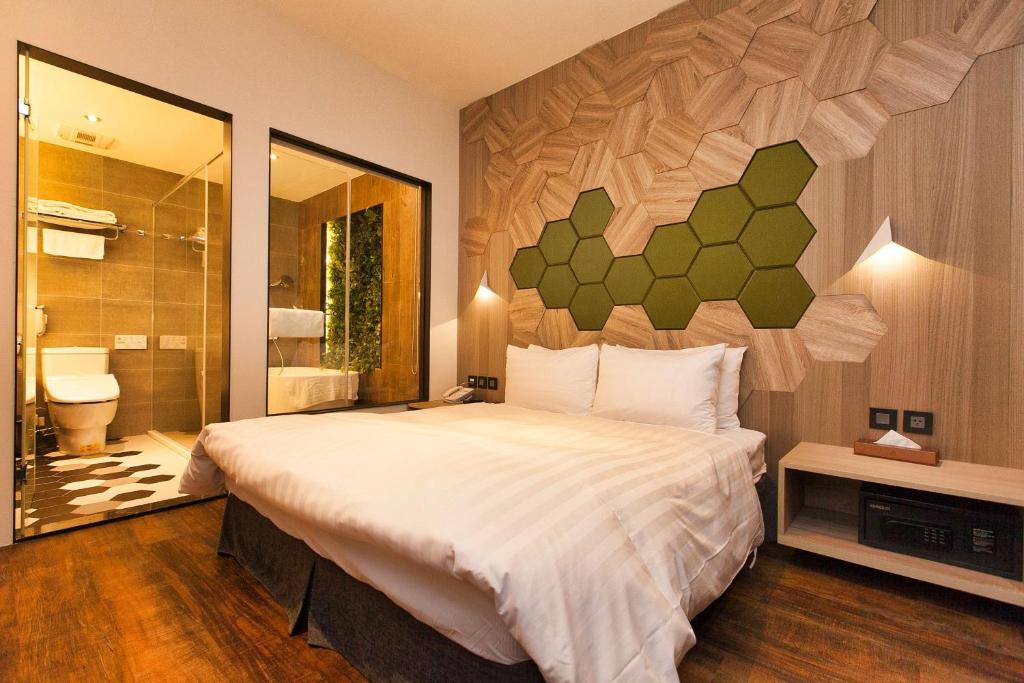 Postel nebo postele na pokoji v ubytování Hotel East Taipei