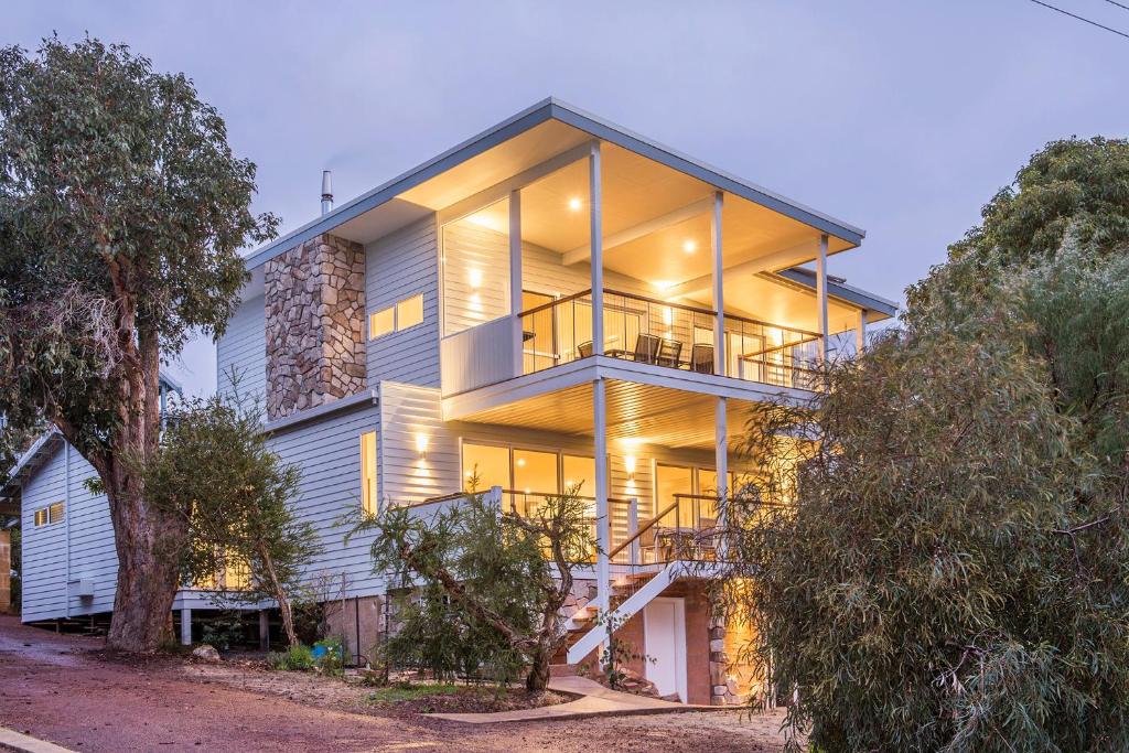 a large house with a balcony on the side of it at Yaringa in Dunsborough