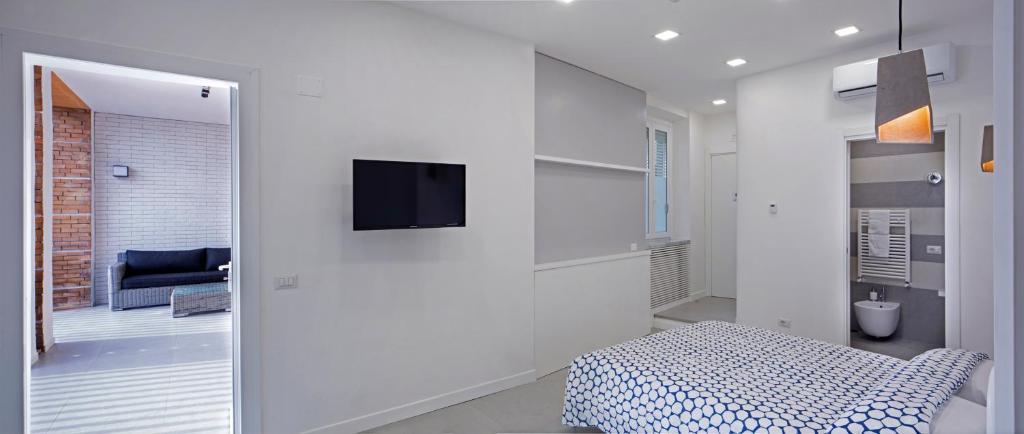 Postel nebo postele na pokoji v ubytování Relais Castel Nuovo