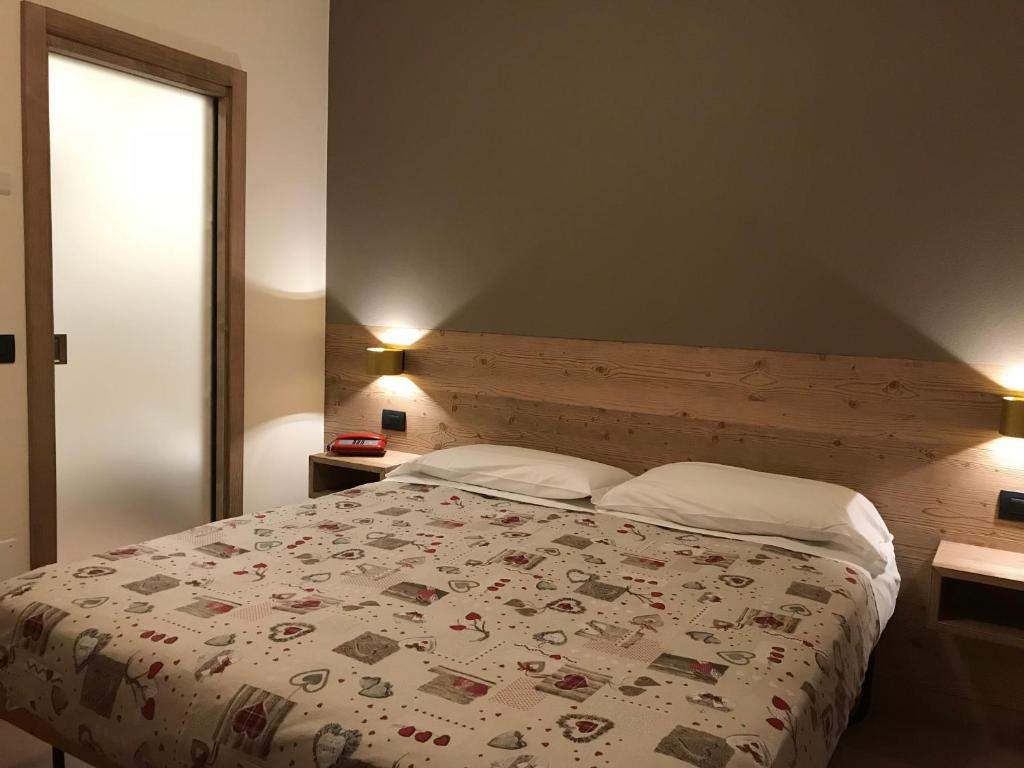 Posteľ alebo postele v izbe v ubytovaní Hotel Piccolo Mondo