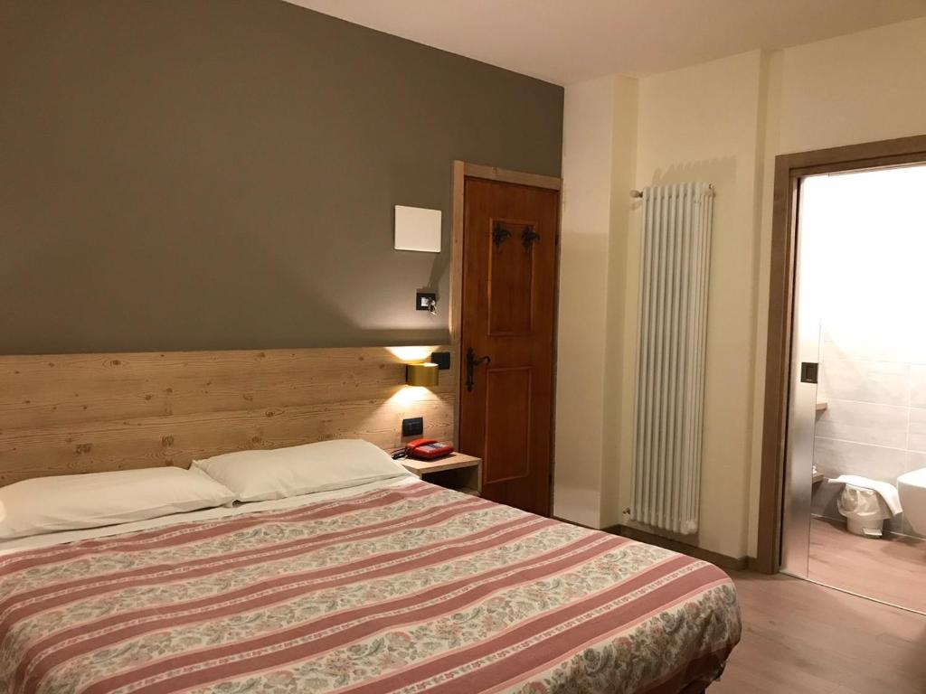 Posteľ alebo postele v izbe v ubytovaní Hotel Piccolo Mondo