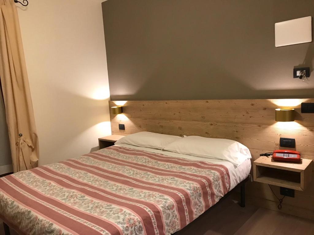 Posteľ alebo postele v izbe v ubytovaní Hotel Piccolo Mondo