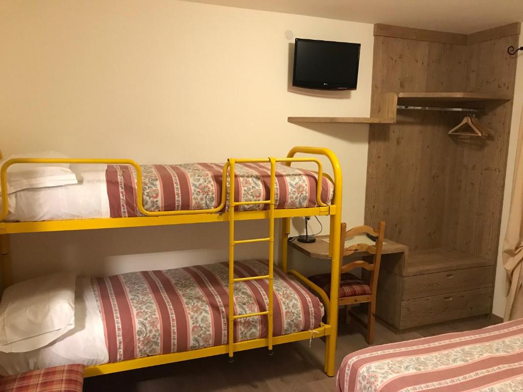 Posteľ alebo postele v izbe v ubytovaní Hotel Piccolo Mondo
