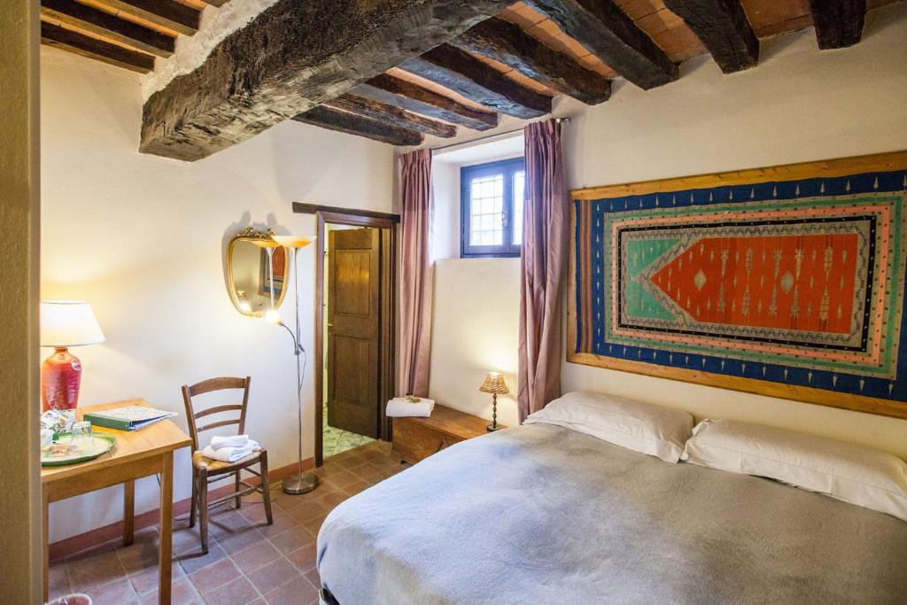 Postel nebo postele na pokoji v ubytování B&B Le Due Volpi