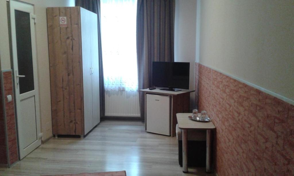 TV a/nebo společenská místnost v ubytování Vila Adriano