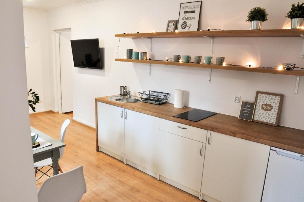 Kuchyňa alebo kuchynka v ubytovaní Apartamenty pod Holicą