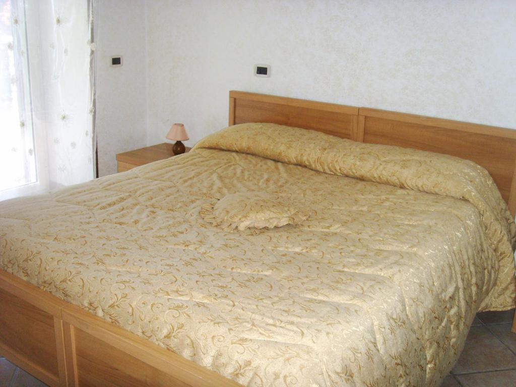 A bed or beds in a room at Casa Lieta