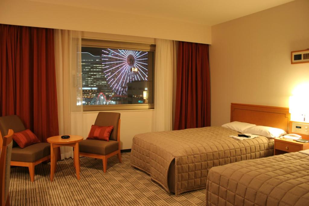 Postel nebo postele na pokoji v ubytování Navios Yokohama
