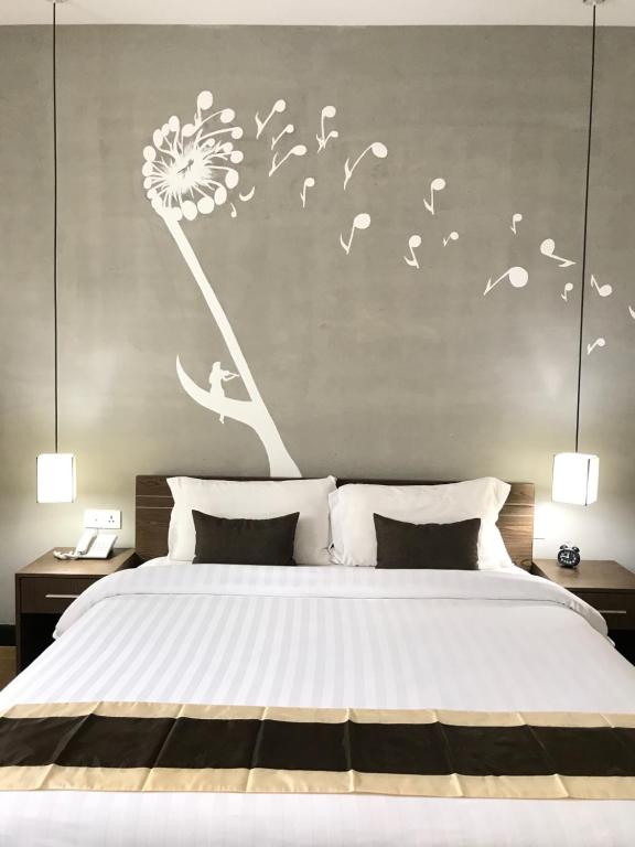 Postel nebo postele na pokoji v ubytování Asiban Quay Boutique Hotel