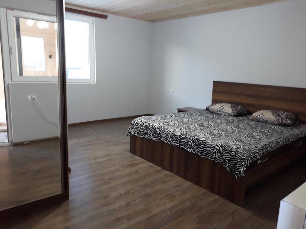 Postel nebo postele na pokoji v ubytování Guest House Khergiani