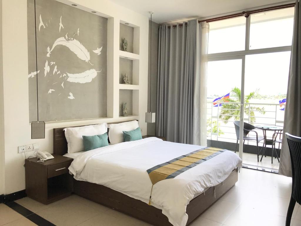 Katil atau katil-katil dalam bilik di Asiban Quay Boutique Hotel