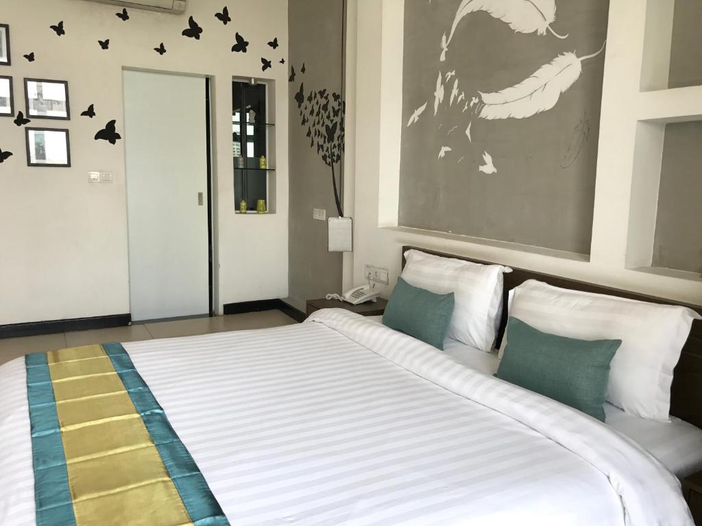 Postel nebo postele na pokoji v ubytování Asiban Quay Boutique Hotel