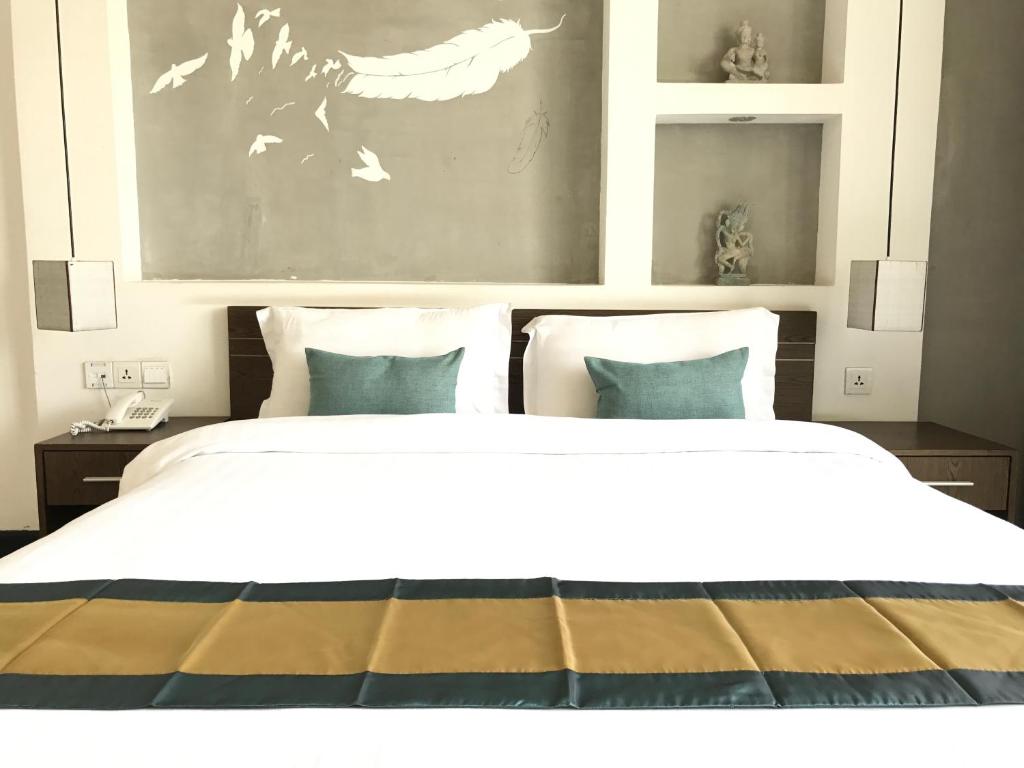 Postel nebo postele na pokoji v ubytování Asiban Quay Boutique Hotel