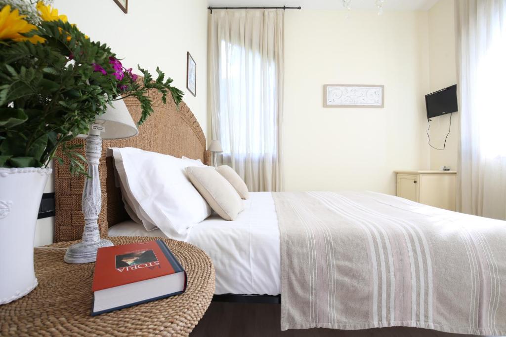 Postel nebo postele na pokoji v ubytování Hotel Villa Stella