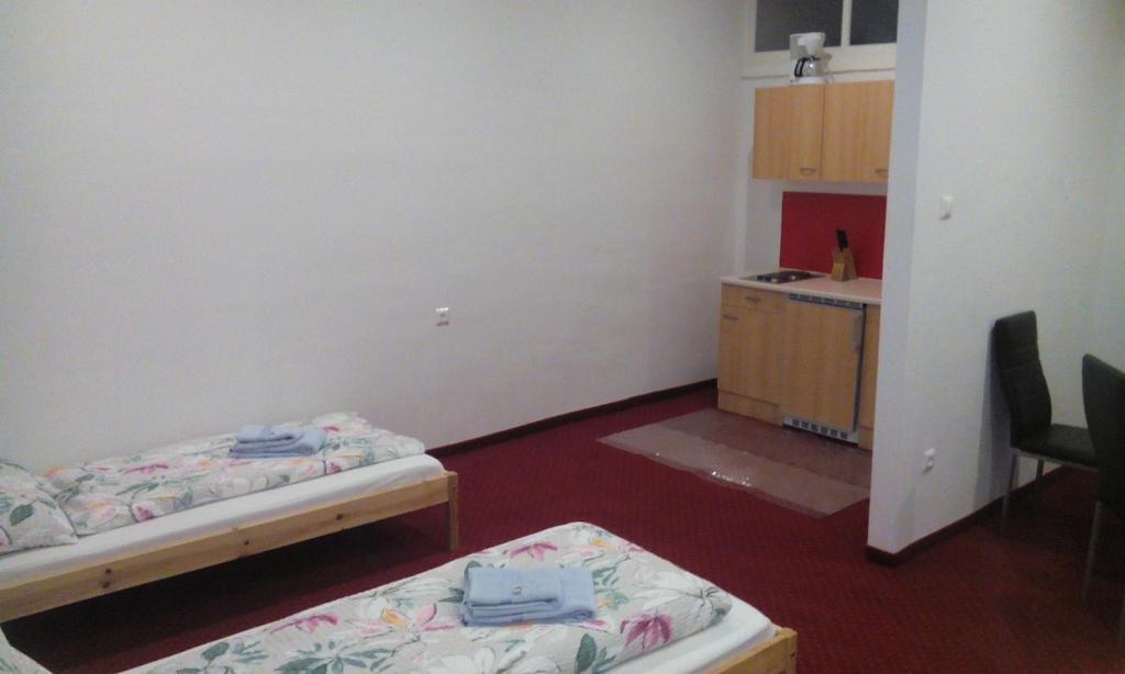 Postel nebo postele na pokoji v ubytování Gasthof zum Nibelungenbauer