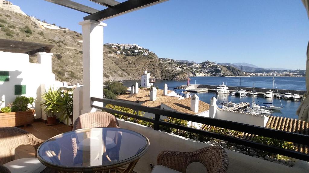 a balcony with a view of a marina at Lovely House with views in Marina del Este in Almuñécar